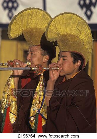 Monks Blowing On Long Horns At Start Of Ceremony At Dawn As Part Of The Monlam Prayer Festival For Tibetan New Year, Nechung Monastery, Near Lhasa, Tibet. View Large Photo Image Picture - Monks Blowing On Long Horns At Start Of Ceremony At Dawn As Part Of The Monlam Prayer Festival For Tibetan New Year, Nechung Monastery, Near Lhasa, Tibet.. Fotosearch