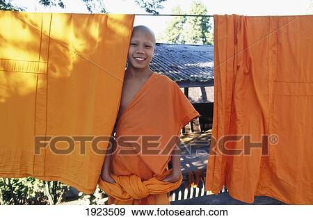 Stock Photo - Monks Dressed In Saffron Dress.. Fotosearch