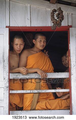 Stock Image - Monks In A Window Of A Wat Ãƒâ€šÃ‚Â . Fotosearch