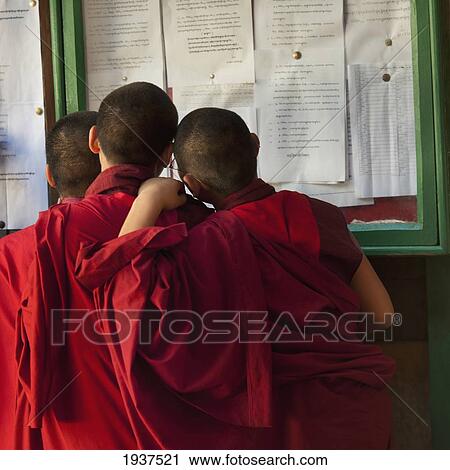 Monks Looking At Posted Papers At Wangdue Dzong Monastery; Wangdue Phodrang District Bhutan View Large Photo Image Stock Image - Monks Looking At Posted Papers At Wangdue Dzong Monastery; Wangdue Phodrang District Bhutan. Fotosearch