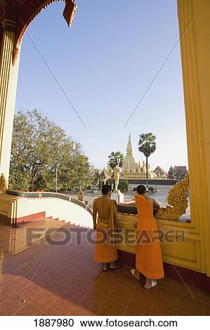 Monks Standing On The Steps Of Wat That Luang Tai. View Large Photo Image Stock Image - Monks Standing On The Steps Of Wat That Luang Tai.. Fotosearch