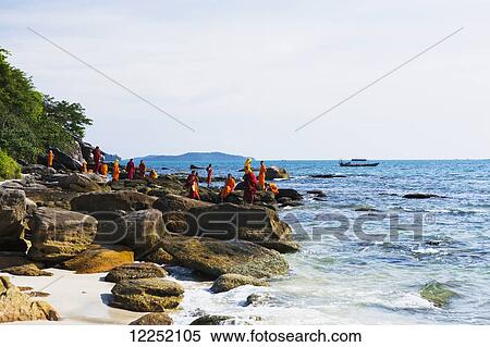 Monks take a group trip to the ocean at Sokha beach; Sihanoukville, Cambodia View Large Photo Image Stock Photography - Monks take a group trip to the ocean at Sokha beach; Sihanoukville, Cambodia. Fotosearch