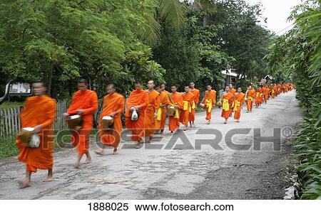 Stock Photography - Monks Walking In Line Collecting Donations, Blurred Motion. Fotosearch