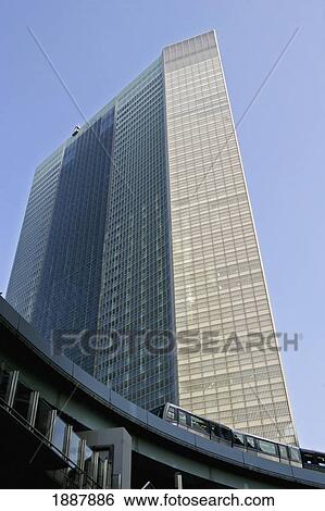 Stock Photograph - Monorail Train Passing Through The Shiodome District. Fotosearch