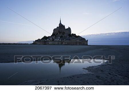 Stock Photo - Mont-Saint-Michel And Mudflats In The Bay At Dusk, As Seen From The East, France. Fotosearch