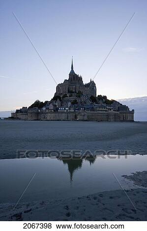 Stock Photo - Mont-Saint-Michel And Mudflats In The Bay At Dusk, As Seen From The East, France. Fotosearch