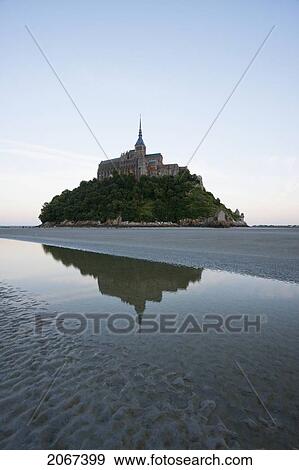 Stock Photo - Mont-Saint-Michel And Mudflats In The Bay At Dusk, As Seen From The North, France. Fotosearch