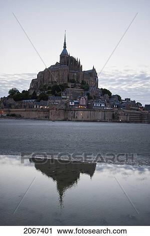 Mont-Saint-Michel And Mudflats Reflected In The Bay At Dusk, As Seen From The East, France View Large Photo Image Stock Image - Mont-Saint-Michel And Mudflats Reflected In The Bay At Dusk, As Seen From The East, France. Fotosearch