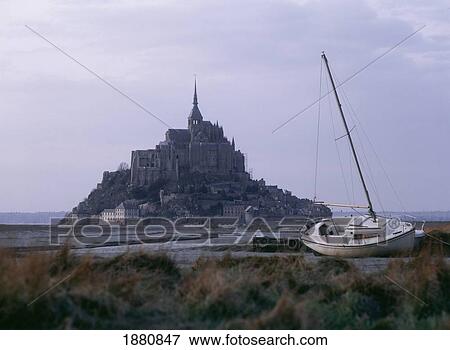 Stock Photo - Mont Saint Michel With Sailboat In Foreground. Fotosearch