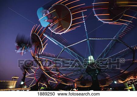 Stock Image - Montjuich Fun Fair At Night. Fotosearch