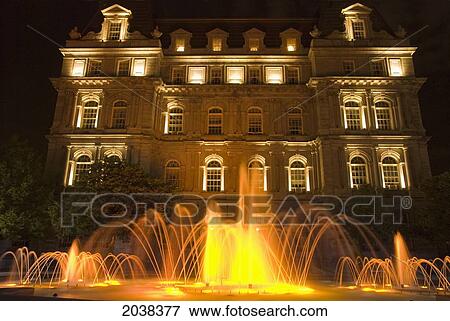 Stock Photo - Montreal City Hall And A Water Fountain Illuminated At Night; Montreal Quebec Canada. Fotosearch