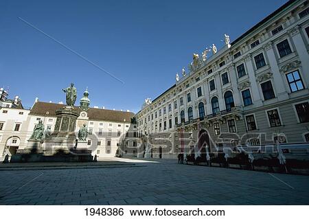 Stock Photograph - Monument to Emperor Franz I of Austria in the Innerer Burghof and Amalienburg in the Hofburg Imperial Palace, Vienna (Wien), Austria. Fotosearch