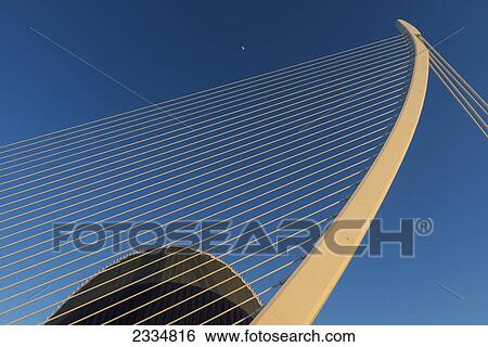 Stock Photograph - Moon Above El Pont De L'assut De L'or And L'agora In Ciudad De Las Artes Y Las Ciencias (City Of Arts And Sciences); Valencia, Spain. Fotosearch