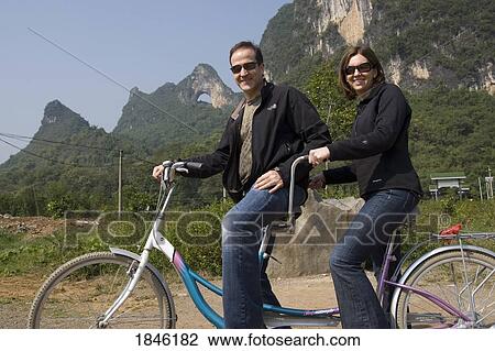 Moon Hill, Yangshuo, China; Couple On Tandem Bike View Large Photo Image Stock Image - Moon Hill, Yangshuo, China; Couple On Tandem Bike. Fotosearch