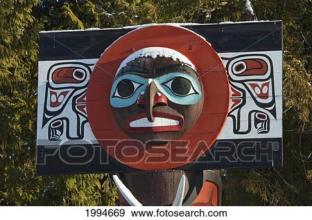 Moon On Chief Skedans Mortuary Pole Carved In Haida Style By Bill Reid With Werner True Covered In Snow In Stanley Park, Vancouver, British Columbia, Canada View Large Photo Image Stock Photo - Moon On Chief Skedans Mortuary Pole Carved In Haida Style By Bill Reid With Werner True Covered In Snow In Stanley Park, Vancouver, British Columbia, Canada. Fotosearch