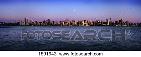 Stock Image - Moon Over Midtown Manhattan Skyline At Dusk. Fotosearch