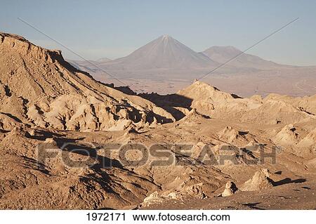Stock Image - Moon Valley With The Licancabur Volcano In The Background, San Pedro De Atacama, Antofagasta Region, Chile. Fotosearch