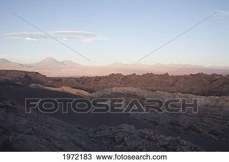 Stock Image - Moon Valley With The Licancabur Volcano In The Background At Sunset, San Pedro De Atacama, Antofagasta Region, Chile. Fotosearch