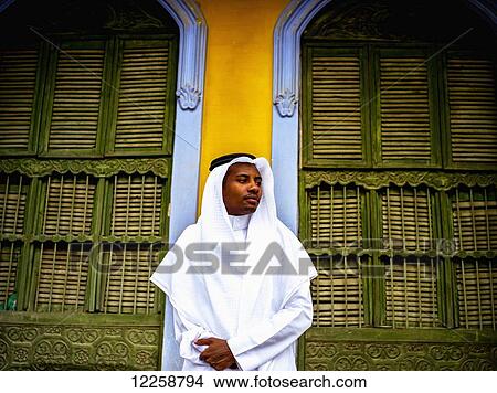 Moor Saudi standing in a doorway of old building; Taif, Saudi Arabia View Large Photo Image Picture - Moor Saudi standing in a doorway of old building; Taif, Saudi Arabia. Fotosearch