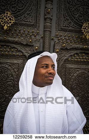 Moor Saudi standing in a doorway of old building; Taif, Saudi Arabia View Large Photo Image Stock Photo - Moor Saudi standing in a doorway of old building; Taif, Saudi Arabia. Fotosearch