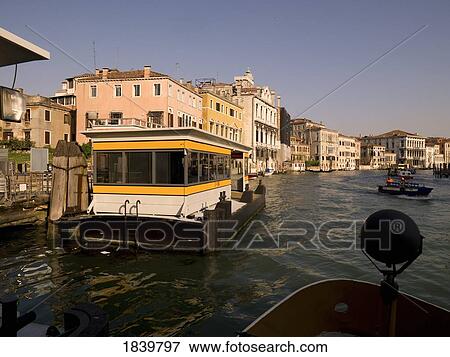 Stock Photo - Moored Boat, Buildings In Background; Grand Canal, Venice, Italy. Fotosearch