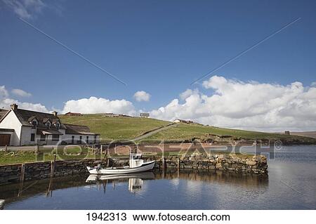 Stock Image - Moored Boat By Dock; Shetland Scotland. Fotosearch