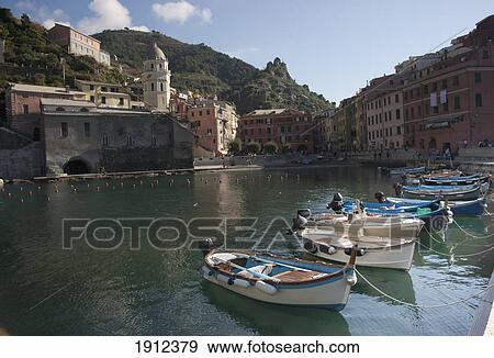 Stock Photo - Moored Boats Along The Coast; Vernazza, Liguria, Italy. Fotosearch