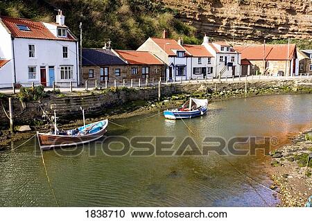 Stock Image - Moored Boats In Staithes; North Yorkshire, England, Uk. Fotosearch