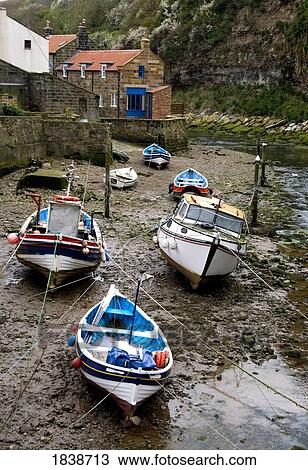 Stock Image - Moored Boats In Staithes; North Yorkshire, England, Uk. Fotosearch