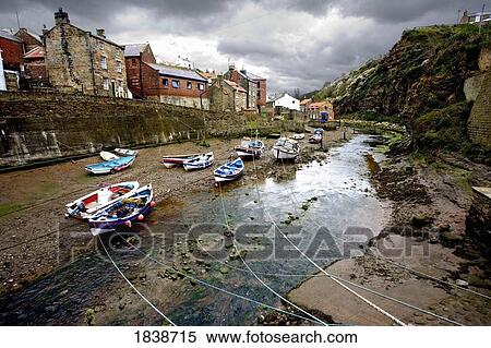 Moored Boats In Staithes; North Yorkshire, England, Uk View Large Photo Image Stock Photography - Moored Boats In Staithes; North Yorkshire, England, Uk. Fotosearch