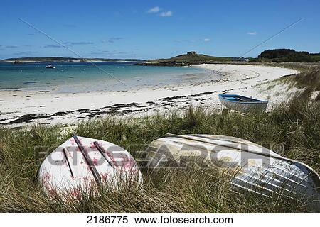 Stock Photography - Moored Small Boats On Green Porth Beach, Old Grimsby, Tresco, Isles Of Scilly, Cornwall, Uk, Europe. Fotosearch