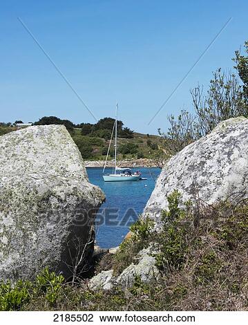 Stock Image - Moored Yacht In The Cove Between Gugh And St Agnes, Isles Of Scilly, Cornwall, Uk, Europe. Fotosearch