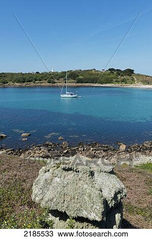 Moored Yacht In The Cove Between Gugh And St Agnes, Isles Of Scilly, Cornwall, Uk, Europe View Large Photo Image Stock Image - Moored Yacht In The Cove Between Gugh And St Agnes, Isles Of Scilly, Cornwall, Uk, Europe. Fotosearch
