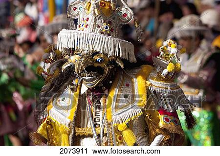 Stock Image - Morenada Dancer Wearing An Elaborate Mask And Costume In The Procession Of The Carnaval De Oruro, Oruro, Bolivia. Fotosearch