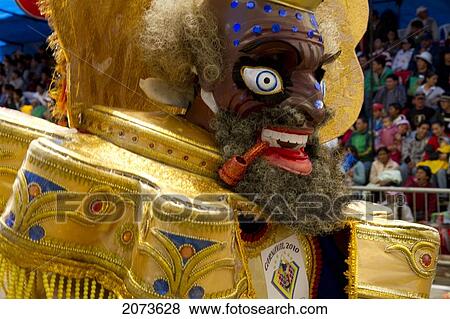 Morenada Dancer Wearing An Elaborate Mask And Costume In The Procession Of The Carnaval De Oruro, Oruro, Bolivia View Large Photo Image Stock Photo - Morenada Dancer Wearing An Elaborate Mask And Costume In The Procession Of The Carnaval De Oruro, Oruro, Bolivia. Fotosearch