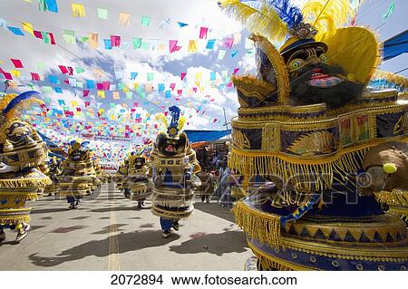 Morenada Dancers Wearing Elaborate Masks And Costumes In The Procession Of The Carnaval De Oruro, Oruro, Bolivia View Large Photo Image Picture - Morenada Dancers Wearing Elaborate Masks And Costumes In The Procession Of The Carnaval De Oruro, Oruro, Bolivia. Fotosearch