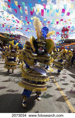 Morenada Dancers Wearing Elaborate Masks And Costumes In The Procession Of The Carnaval De Oruro, Oruro, Bolivia View Large Photo Image Picture - Morenada Dancers Wearing Elaborate Masks And Costumes In The Procession Of The Carnaval De Oruro, Oruro, Bolivia. Fotosearch