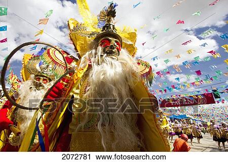 Morenada Dancers Wearing Elaborate Masks And Costumes In The Procession Of The Carnaval De Oruro, Oruro, Bolivia View Large Photo Image Stock Image - Morenada Dancers Wearing Elaborate Masks And Costumes In The Procession Of The Carnaval De Oruro, Oruro, Bolivia. Fotosearch