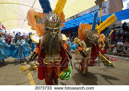 Morenada Dancers Wearing Elaborate Masks And Costumes In The Procession Of The Carnaval De Oruro, Oruro, Bolivia View Large Photo Image Stock Image - Morenada Dancers Wearing Elaborate Masks And Costumes In The Procession Of The Carnaval De Oruro, Oruro, Bolivia. Fotosearch