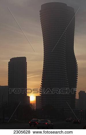 Stock Photo - Morning Fog Shrouds The Absolute World Condominium Towers By Yansong Ma; Mississauga Ontario Canada. Fotosearch