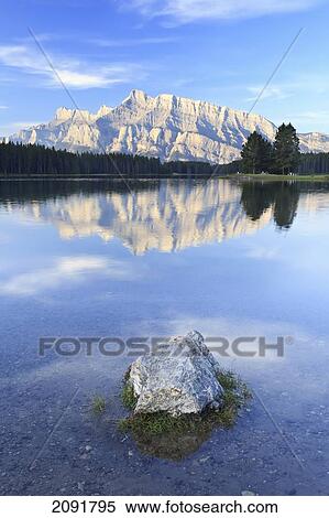 Stock Photography - Morning Reflection Of Mount Rundle In Two Jack Lake In Banff National Park; Banff, Alberta, Canada. Fotosearch