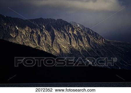 Stock Image - Morning Sunlight Hits Cathedral Mountain, Atlin Provincial Park, British Columbia, Canada. Fotosearch