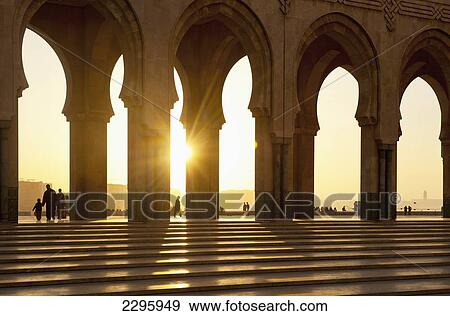 Stock Photo - Morocco, Archways of Hassan II mosque at dusk; Casablanca. Fotosearch