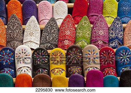 Stock Image - Morocco, Babouche slippers for sale in shop in souks; Fez. Fotosearch