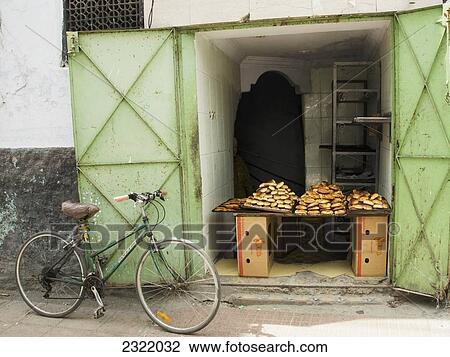 Morocco, Casablanca, Old Medina, Bread for sale in shop with bicycle outside View Large Photo Image Stock Image - Morocco, Casablanca, Old Medina, Bread for sale in shop with bicycle outside. Fotosearch