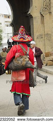 Stock Image - Morocco, Casablanca, Pedestrians on street in Old Medina. Fotosearch