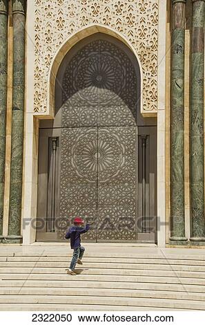 Morocco, Casablanca, Young boy jumping on steps of Hassan II Mosque View Large Photo Image Stock Image - Morocco, Casablanca, Young boy jumping on steps of Hassan II Mosque. Fotosearch