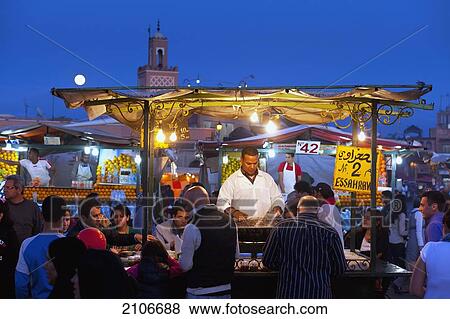 Morocco, Cook serving food at stall in Djemaa el-Fna Square; Marrakech View Large Photo Image Stock Photo - Morocco, Cook serving food at stall in Djemaa el-Fna Square; Marrakech. Fotosearch