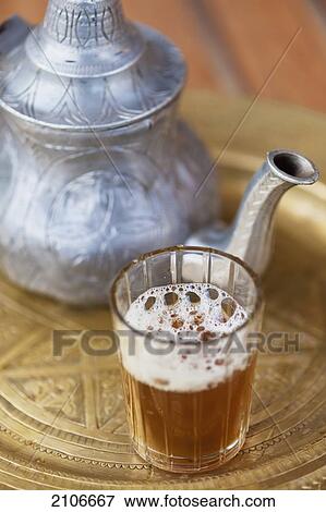 Stock Photo - Morocco, Dar Ahlam Hotel; Skoura, Moroccan mint tea with pot. Fotosearch