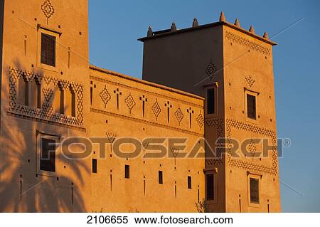 Morocco, Date palm shadow on wall of main kasbah of Dar Ahlam Hotel at dusk; Skoura View Large Photo Image Stock Photography - Morocco, Date palm shadow on wall of main kasbah of Dar Ahlam Hotel at dusk; Skoura. Fotosearch